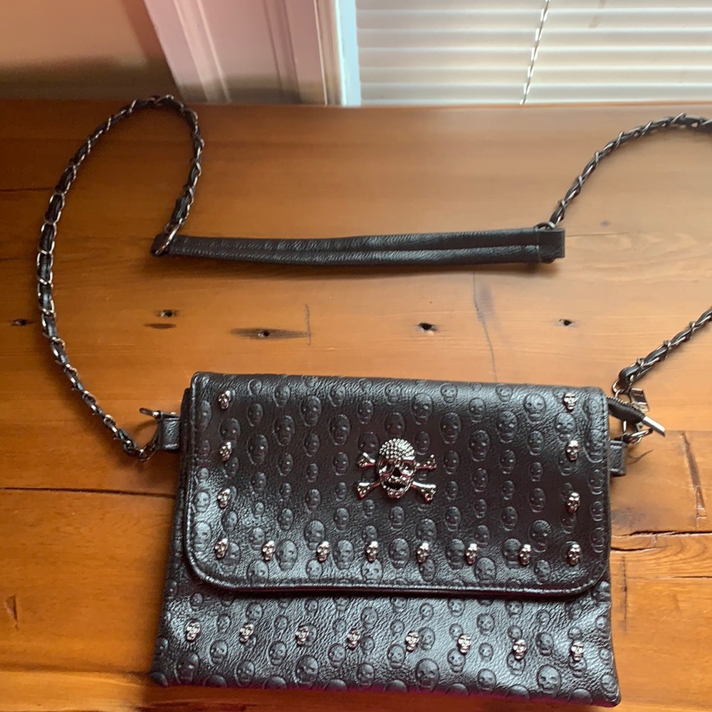 Embossed studded skull bag